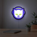 Napster LED lightbox hanging on a room wall with soft white light