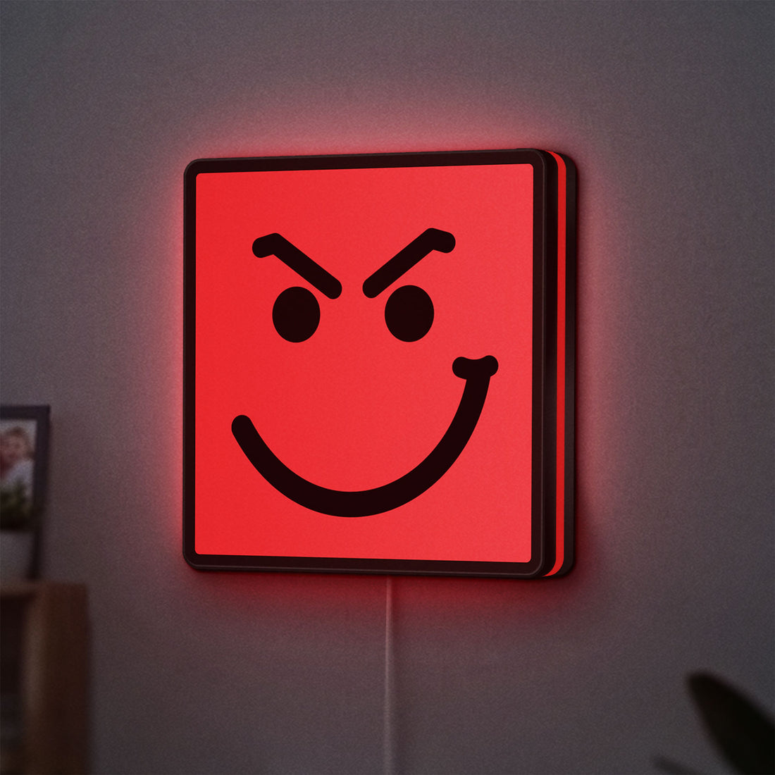 Have A Nice Day LED lightbox hanging on a wall with red glow