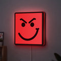 Have A Nice Day LED lightbox hanging on a wall with red glow