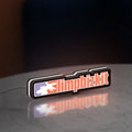 Limp Bizkit LED lightbox standing on a desk from an angled side view with white glow