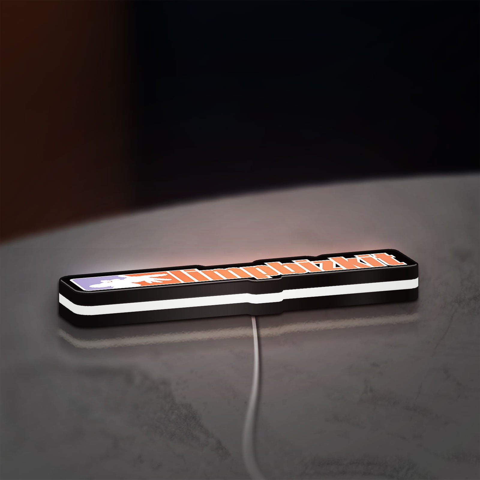 Limp Bizkit LED lightbox lying flat on a desk with white glow