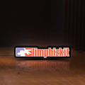Front view of Limp Bizkit LED lightbox sign glowing on a wooden desk