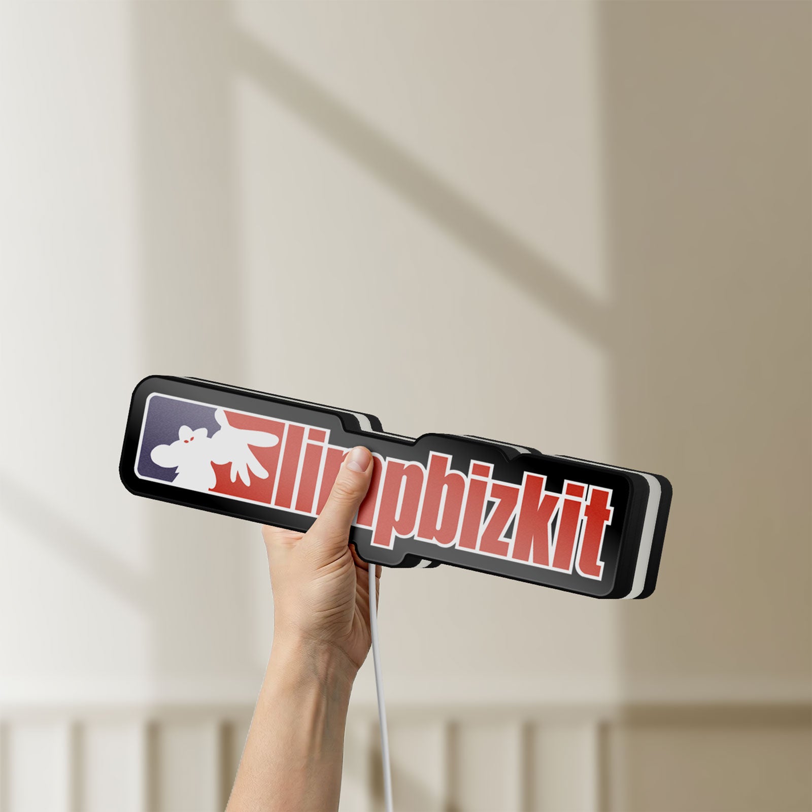 Unlit Limp Bizkit LED lightbox held by hand to show size and details