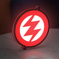 Zoe LED lightbox standing on a desk from an angled side view with red glow