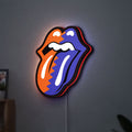 Rolling Stones LED lightbox hanging on a wall with red glow