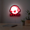 Custom Music LED lightbox hanging on a room wall with soft red light