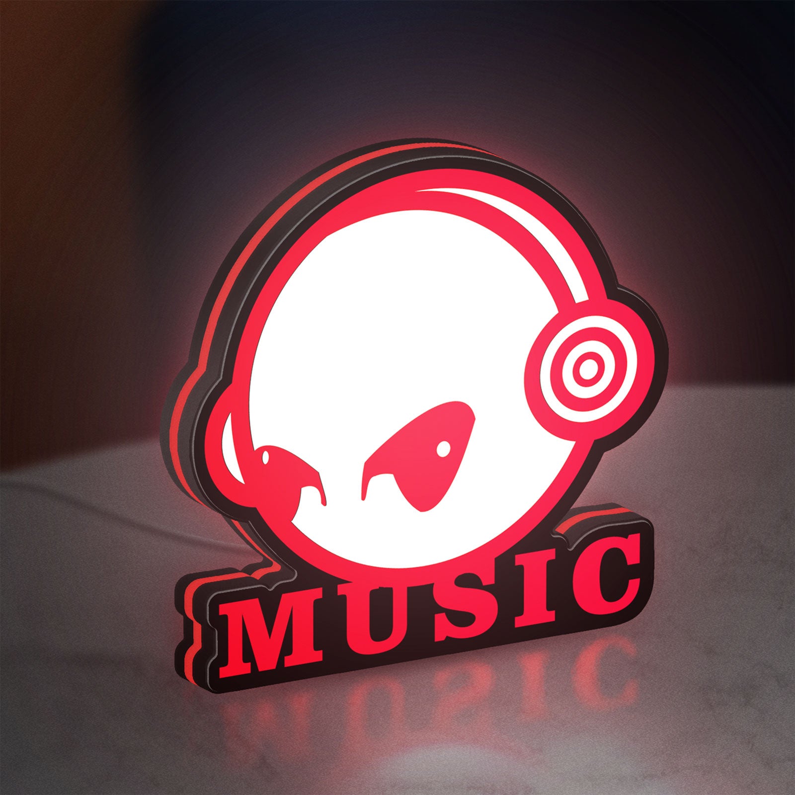 Custom Music LED lightbox standing on a desk from an angled side view with red glow