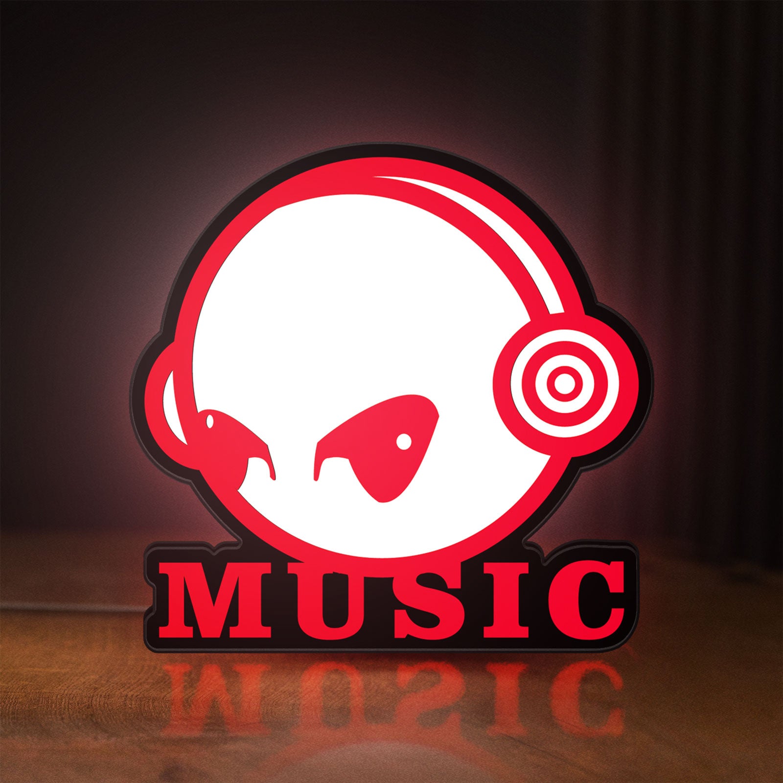 Front view of Custom Music LED lightbox sign glowing on a wooden desk