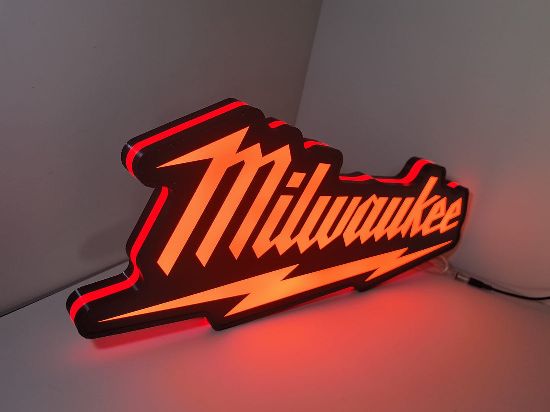Milwaukee Play Button LED Light Box (50cm) - Illuminated angled view standing, perfect for garage and man cave decor