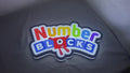 Product video showcase of Numberblocks 3D LED Sign, demonstrating unlit and illuminated lighting effects with a 360-degree rotating view, unique wall art for desk and room decor.