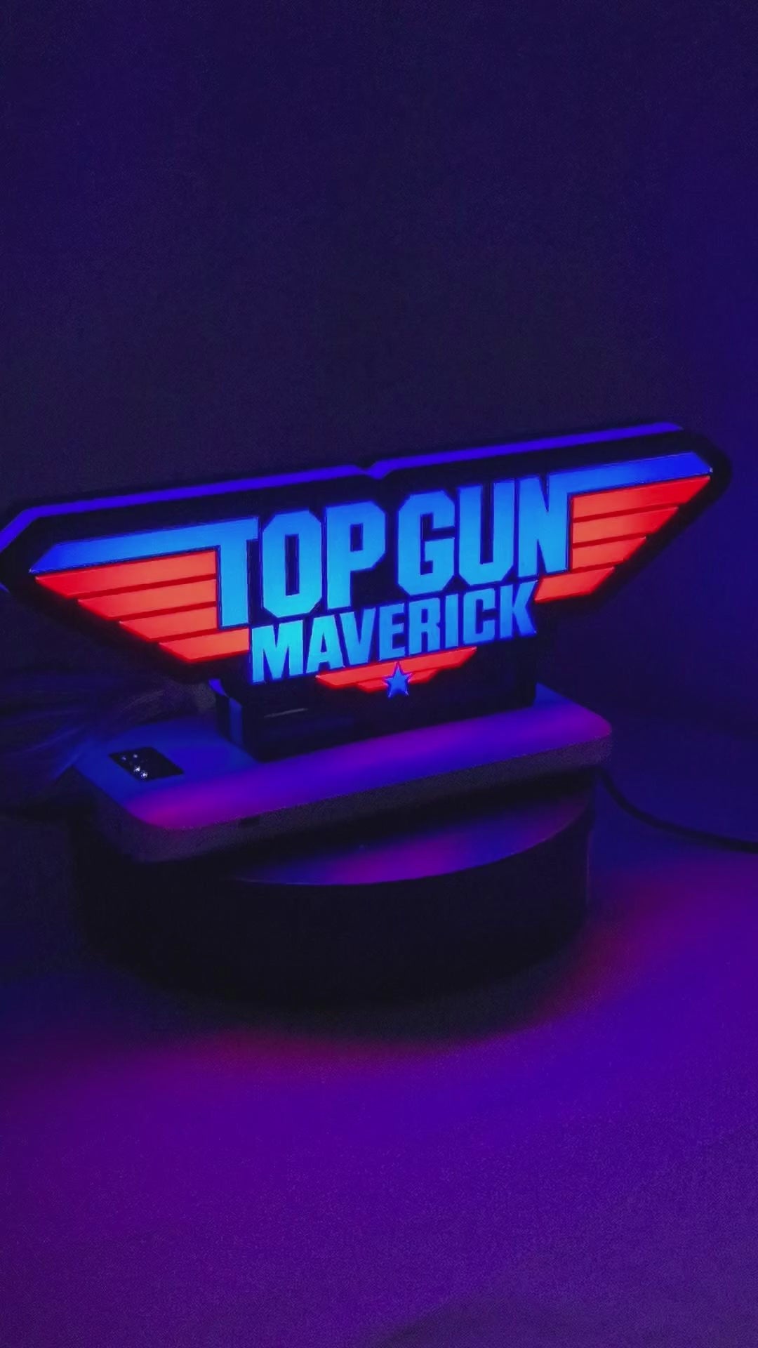 Product video showcase of Top Gun Maverick 3D LED Sign, demonstrating unlit and illuminated lighting effects with a 360-degree rotating view, great for home theater and media room decor.