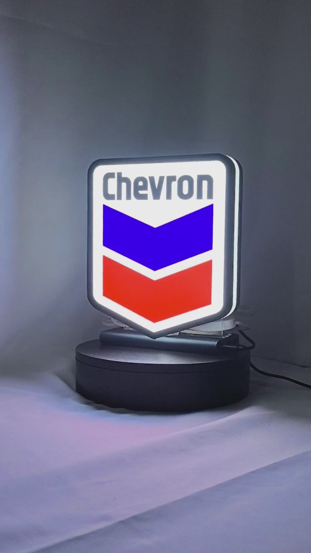 Product video showcase of Chevron 3D LED Sign, demonstrating unlit and illuminated lighting effects with a 360-degree rotating view, unique wall art for desk and room decor.