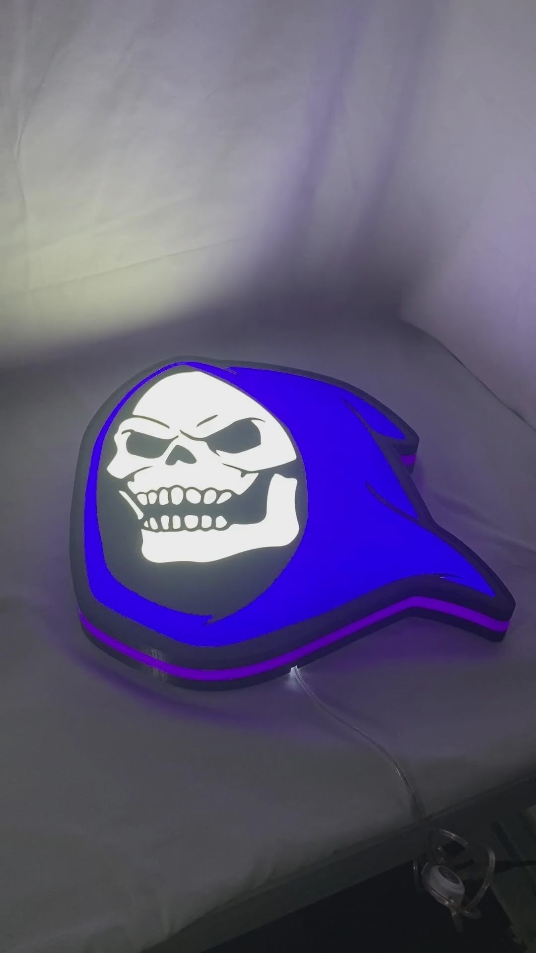 Product video showcase of Skeletor 3D LED Sign, demonstrating unlit and illuminated lighting effects with a 360-degree rotating view, unique wall art for desk and room decor.