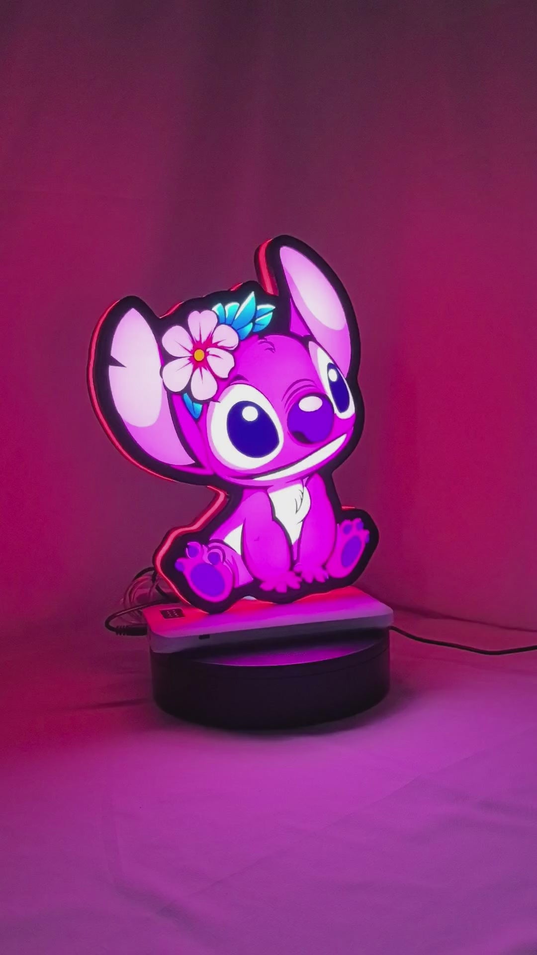 Product video showcase of Pink Stitch 3D LED Sign, demonstrating unlit and illuminated lighting effects with a 360-degree rotating view, unique wall art for desk and room decor.