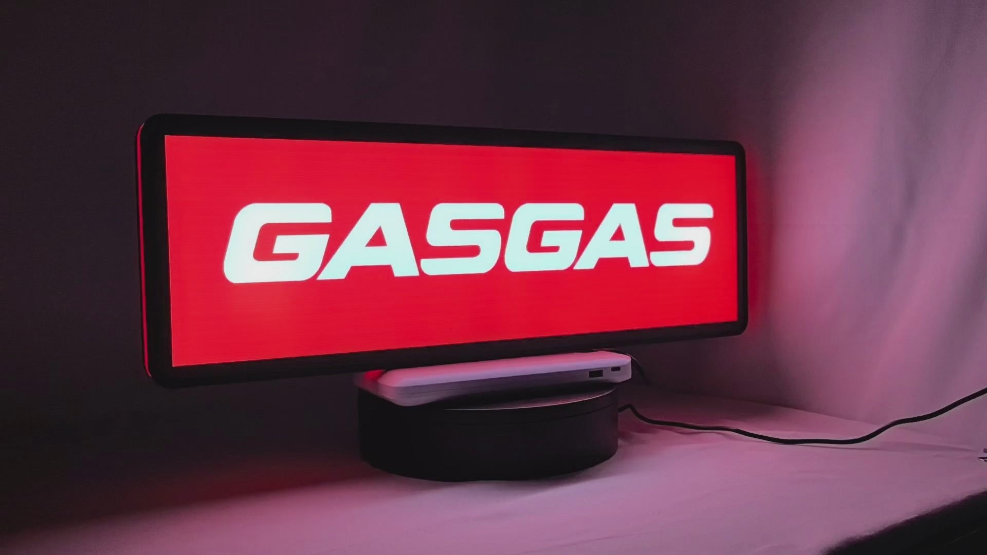 Product video showcase of Gasgas 3D LED Sign, demonstrating unlit and illuminated lighting effects with a 360-degree rotating view, unique wall art for desk and room decor.