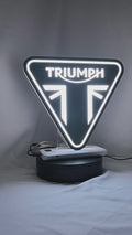 Product video showcase of Triumph Motorcycles 3D LED Sign, demonstrating unlit and illuminated lighting effects with a 360-degree rotating view, perfect for garage and man cave decor.