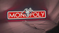 Product video showcase of Monopoly Money Bag 3D LED Sign, demonstrating unlit and illuminated lighting effects with a 360-degree rotating view, unique wall art for desk and room decor.