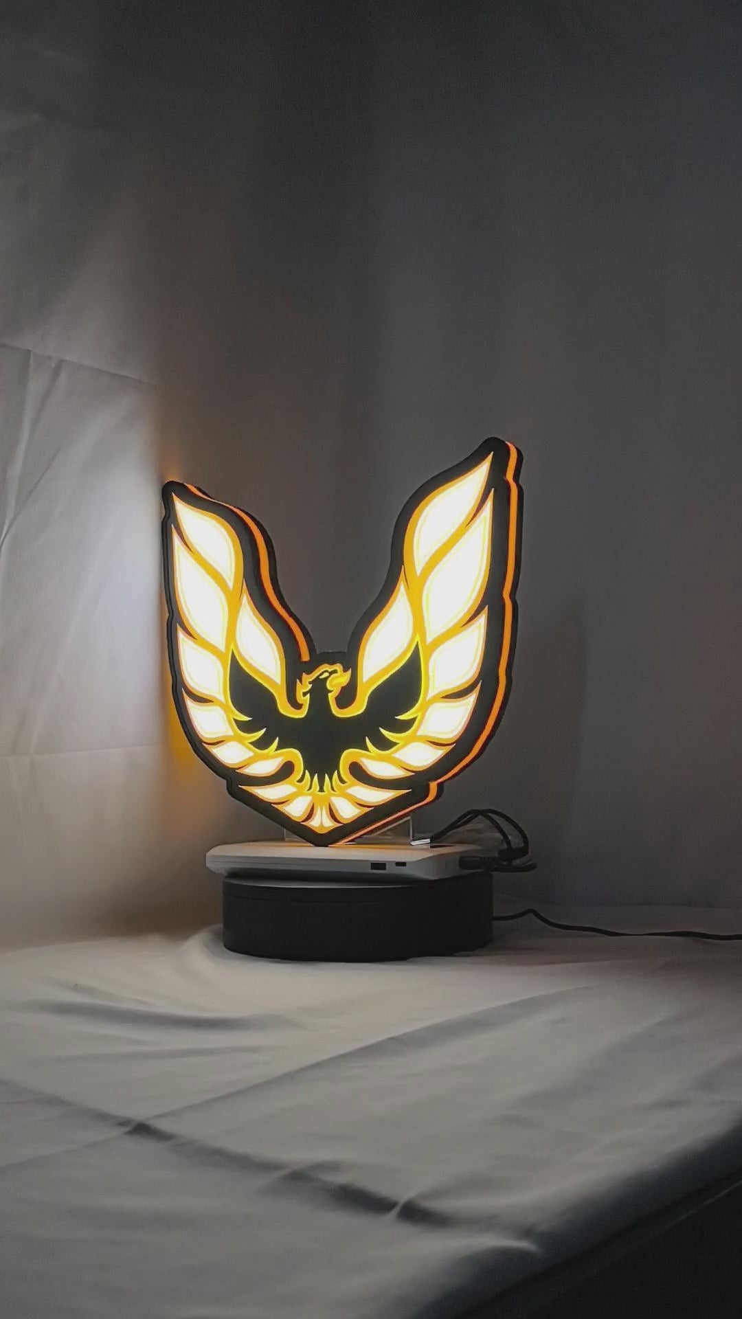 Product video showcase of Pontiac Firebird 1977 3D LED Sign, demonstrating unlit and illuminated lighting effects with a 360-degree rotating view, perfect for garage and man cave decor.
