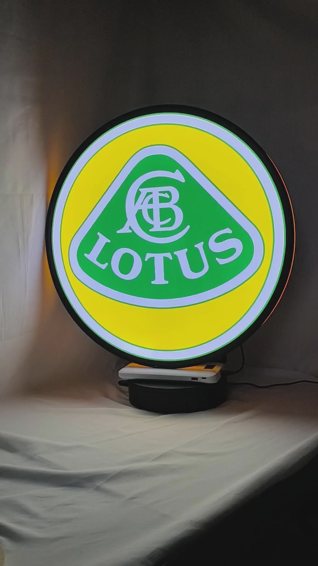 Product video showcase of Lotus Cars 3D LED Sign, demonstrating unlit and illuminated lighting effects with a 360-degree rotating view, perfect for garage and man cave decor.