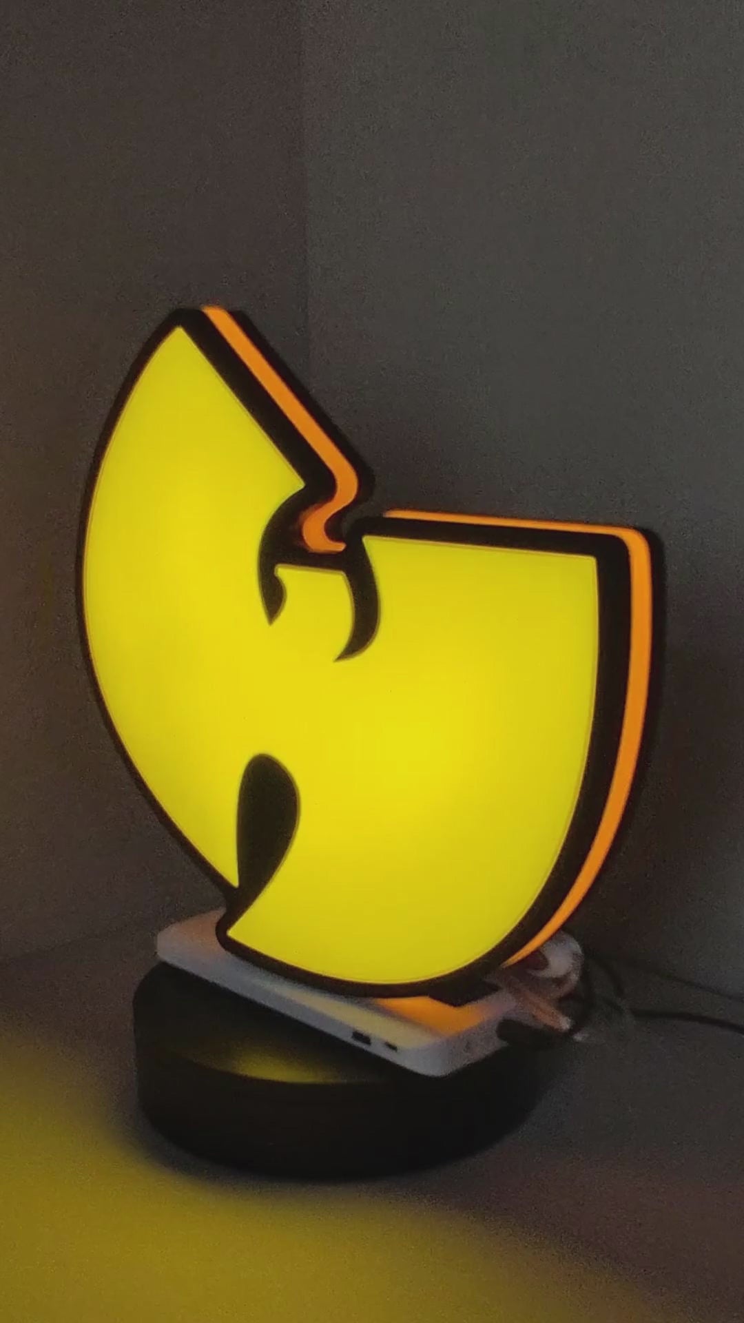 Product video showcase of Wu Tang 3D LED Sign, demonstrating unlit and illuminated lighting effects with a 360-degree rotating view, unique wall art for desk and room decor.