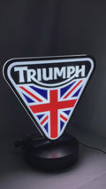 Product video showcase of Triumph 3D LED Sign, demonstrating unlit and illuminated lighting effects with a 360-degree rotating view, perfect for garage and man cave decor.