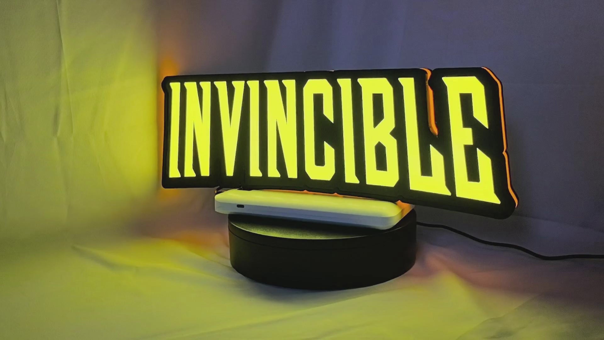 Product video showcase of Invincible 3D LED Sign, demonstrating unlit and illuminated lighting effects with a 360-degree rotating view, cool game room and bedroom decor.