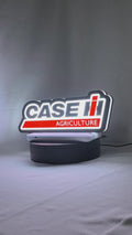 Product video showcase of Case Ih Agriculture 3D LED Sign, demonstrating unlit and illuminated lighting effects with a 360-degree rotating view, unique wall art for desk and room decor.