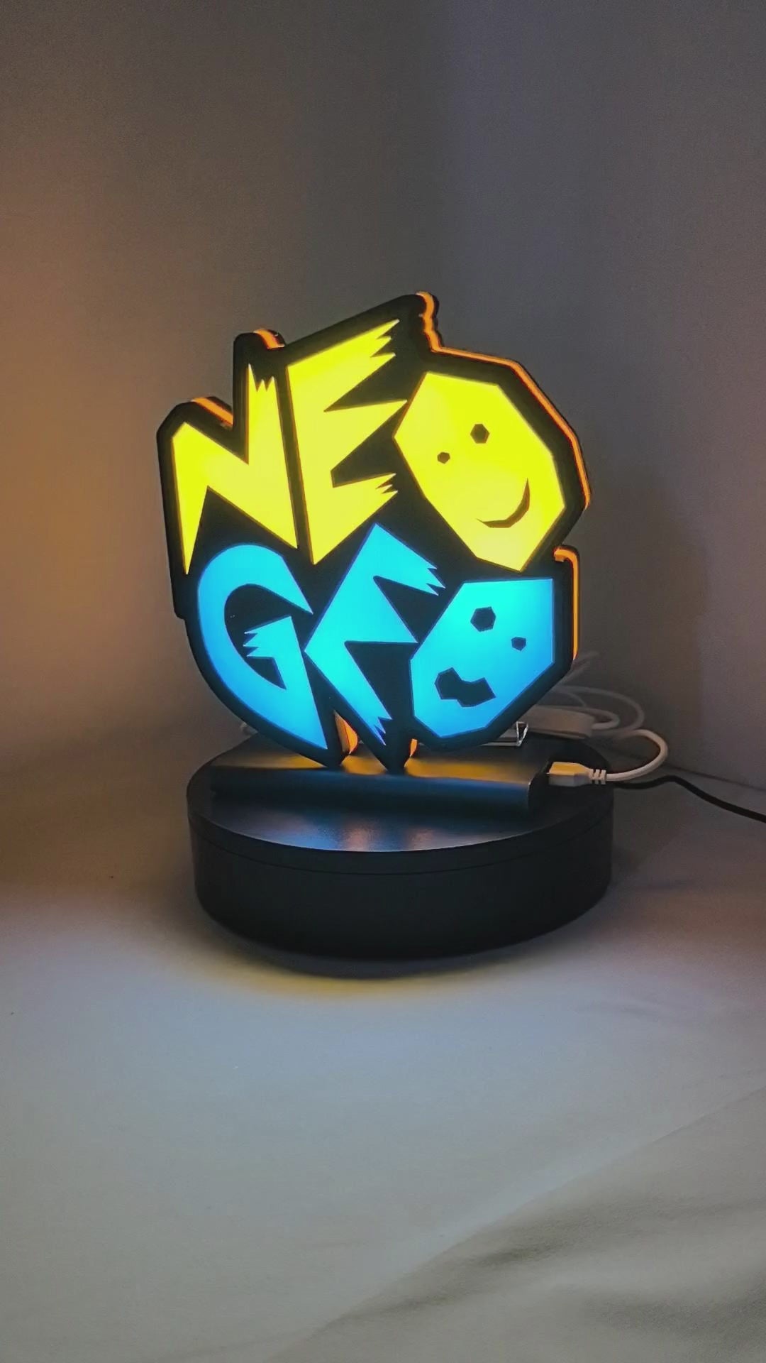 Product video showcase of Neo Geo Arcade 3D LED Sign, demonstrating unlit and illuminated lighting effects with a 360-degree rotating view, cool game room and bedroom decor.