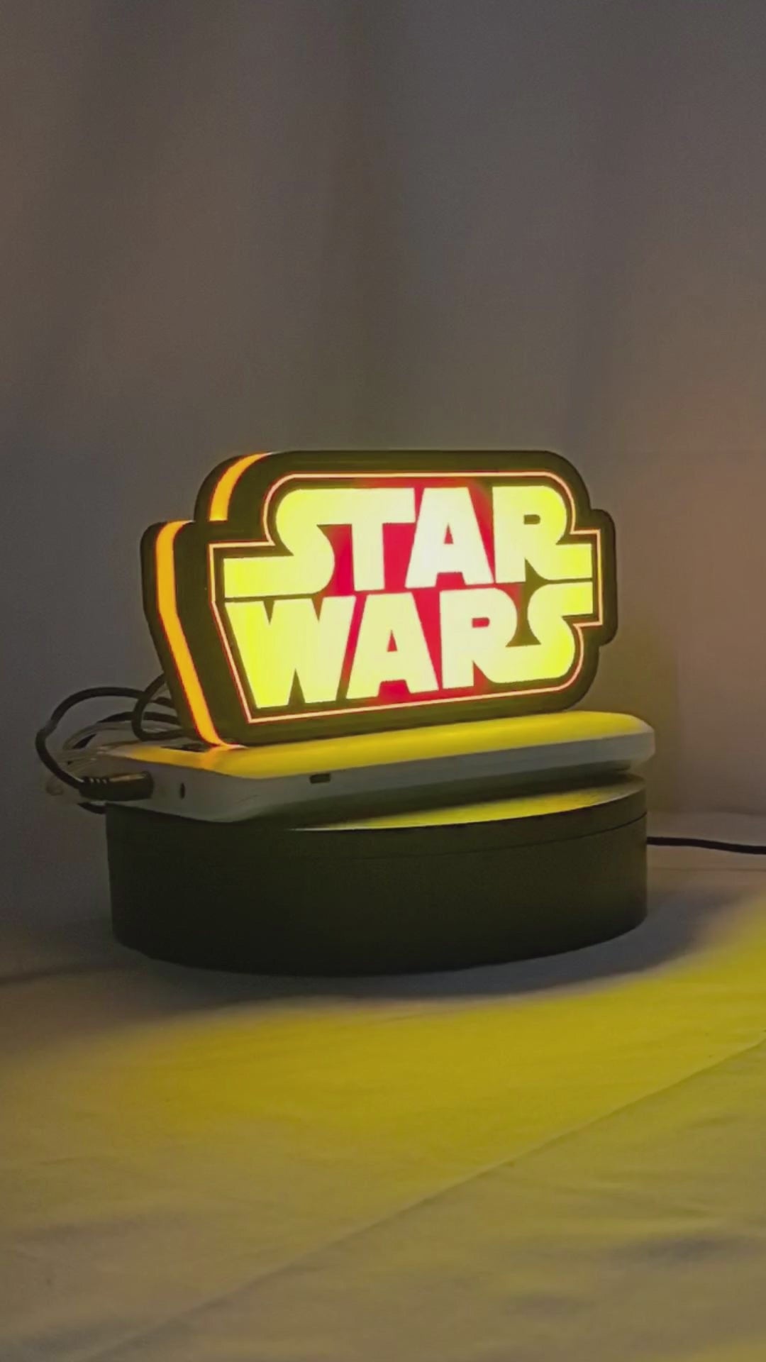Product video showcase of Star Wars 3D LED Sign, demonstrating unlit and illuminated lighting effects with a 360-degree rotating view, great for home theater and media room decor.