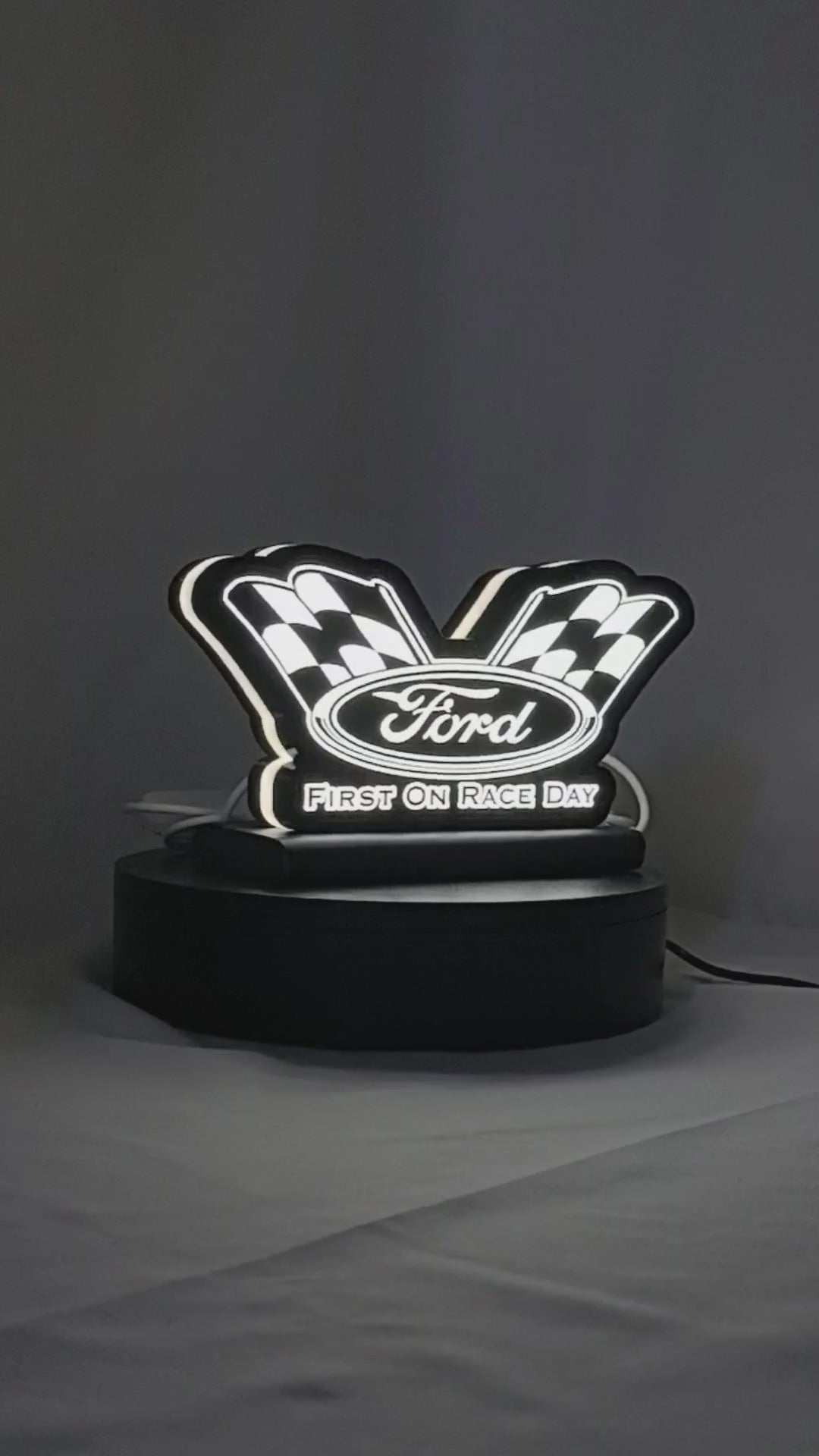 Product video showcase of Ford Racing 3D LED Sign, demonstrating unlit and illuminated lighting effects with a 360-degree rotating view, perfect for garage and man cave decor.