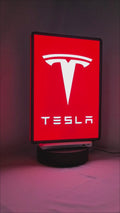 Product video showcase of Tesla 3D LED Sign, demonstrating unlit and illuminated lighting effects with a 360-degree rotating view, perfect for garage and man cave decor.